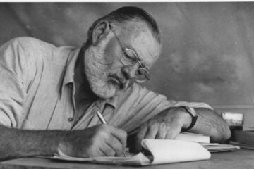 Ernest Hemingway Writing at Campsite in Kenya NARA 192655 1 1 e1618580472615