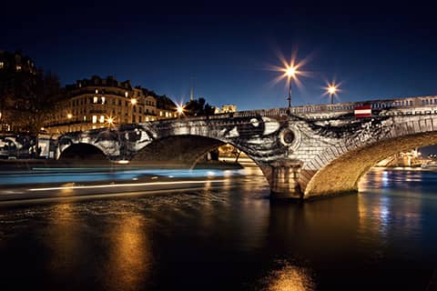 28 Millim¿tres Women Are Heroes Exhibition in Paris Pont Louis Philippe Pont Marie side by night with barge France 2010